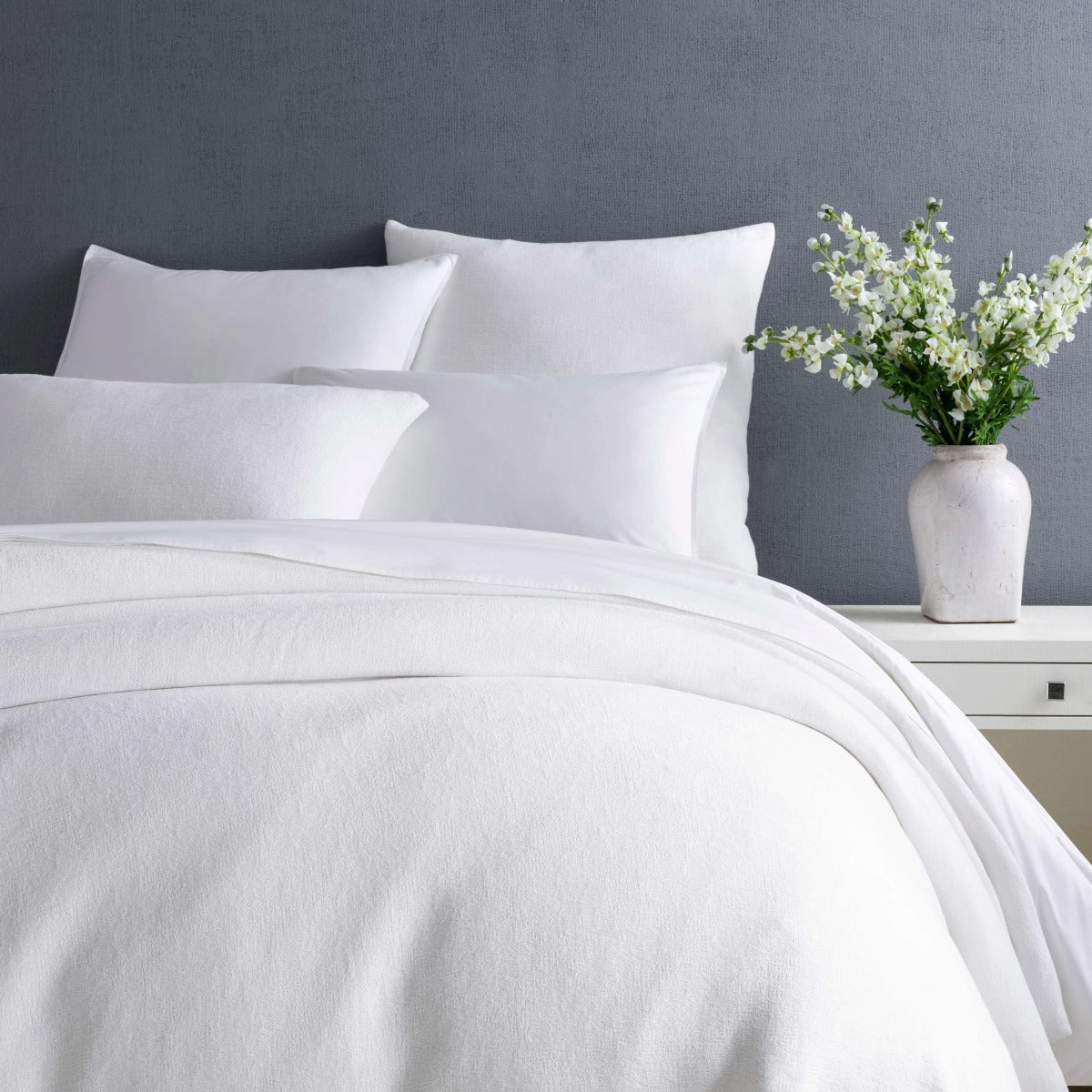 Montauk White Duvet Cover styled with white sheets. Styled view. 