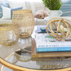 More Beautiful: All American Decoration styled on a gold coffee table with decor. Styled view.
