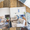 More Beautiful: All American Decoration styled open on a jute rug. Styled view.