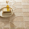 Ojai Wheat Loom Knotted Cotton Rug styled under a decorative tray. Styled view.