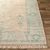 Ollie Rug styled over light wood floor. Styled view.