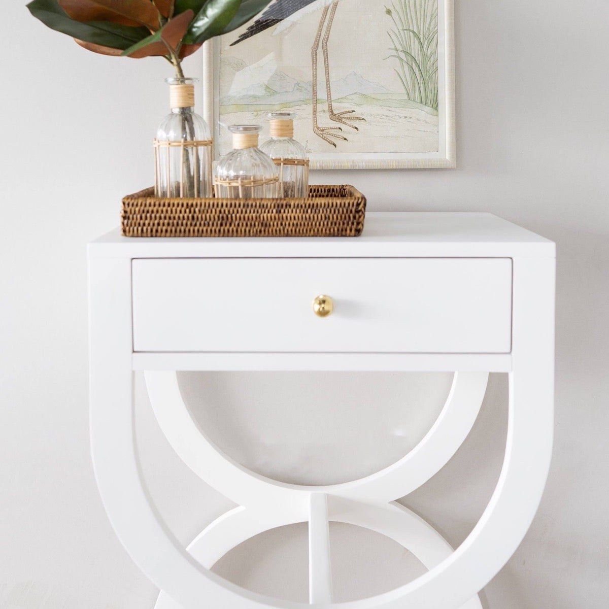 Paige Side Table styled with a rattan tray. Styled view.