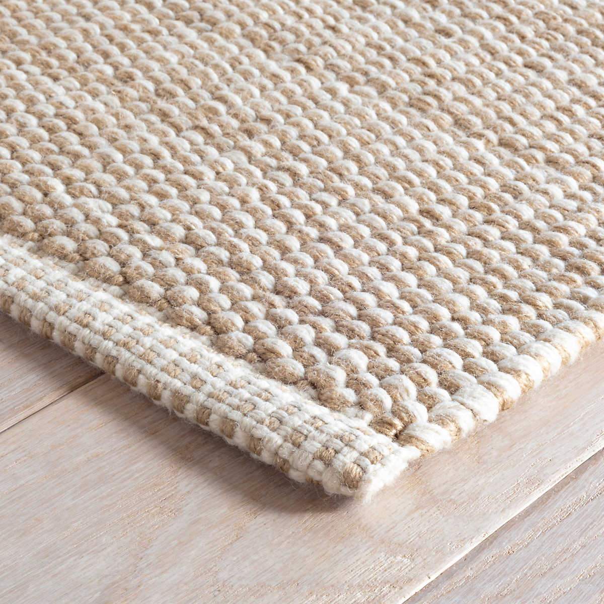 Pebble Natural Indoor/Outdoor Rug corner detail. Close-up corner view.