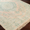 Perry Rug styled over dark wood floors. Styled view.