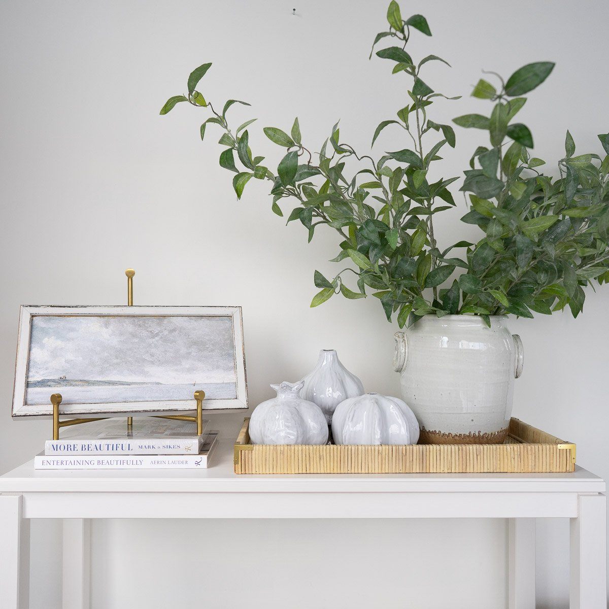 Petite Scapes - Coastal Scene with Cliffs styled on a white table with white decor. Styled view.