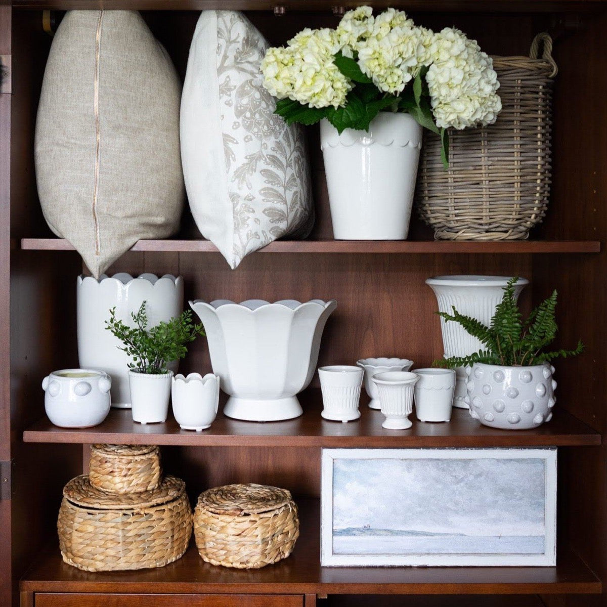 Petite Scapes - Coastal Scene with Cliffs styled in a wood shelf with summer decor. Styled view.
