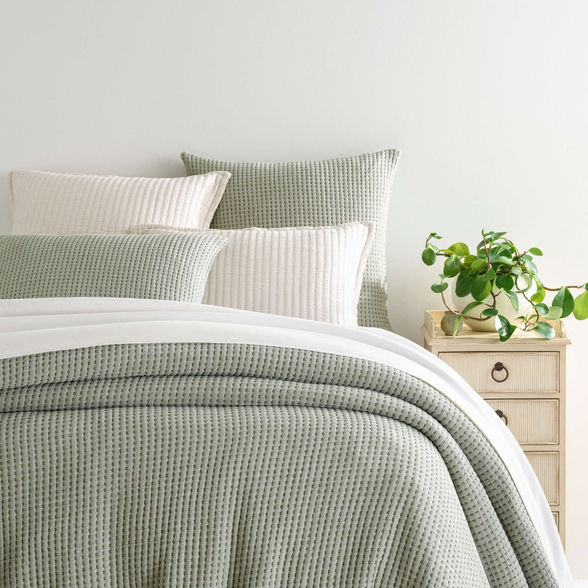 Pick Stitch Evergreen Matelasse Coverlet styled with white bedding. Styled view.