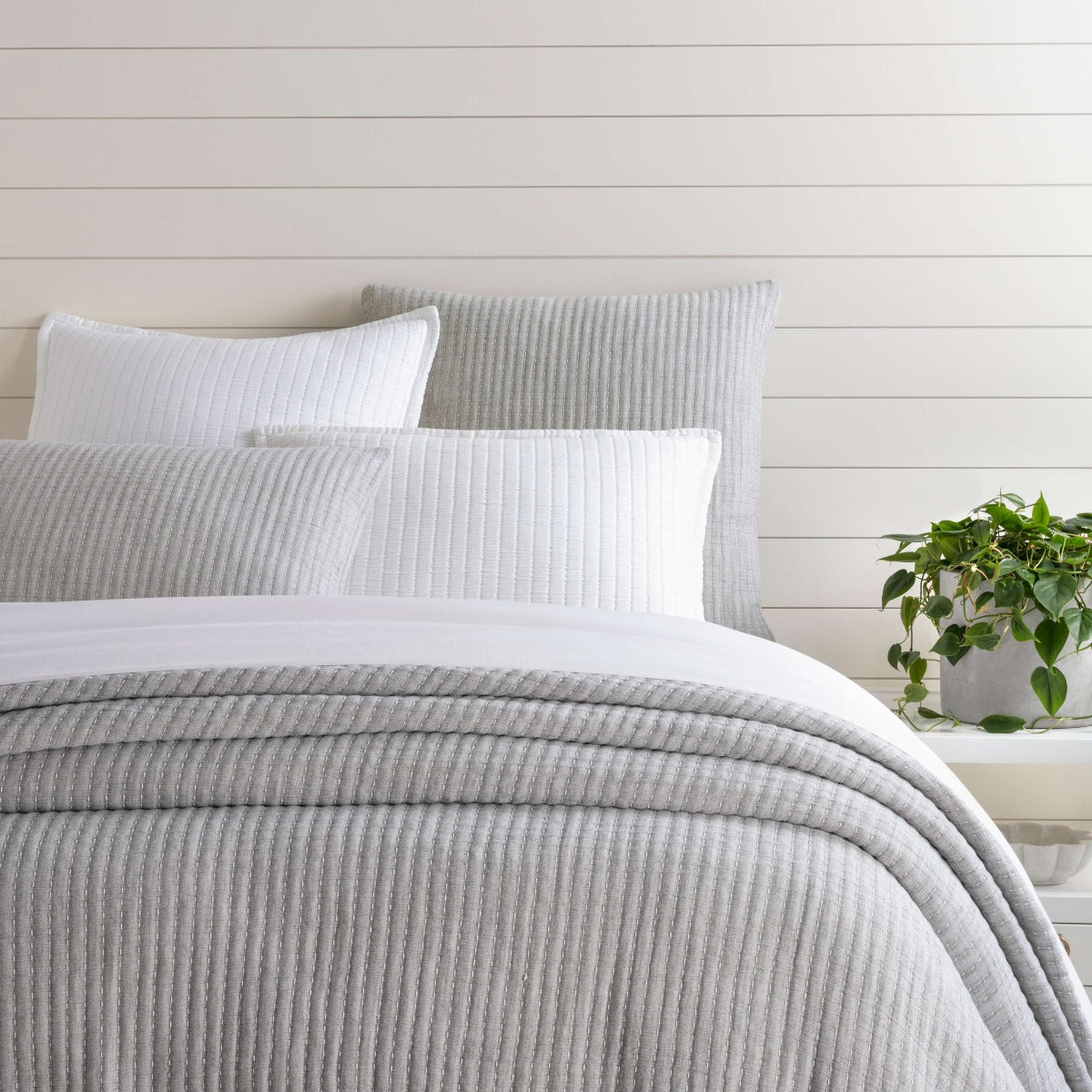Pick Stitch Grey Matelasse Coverlet styled with white bedding. Styled view.