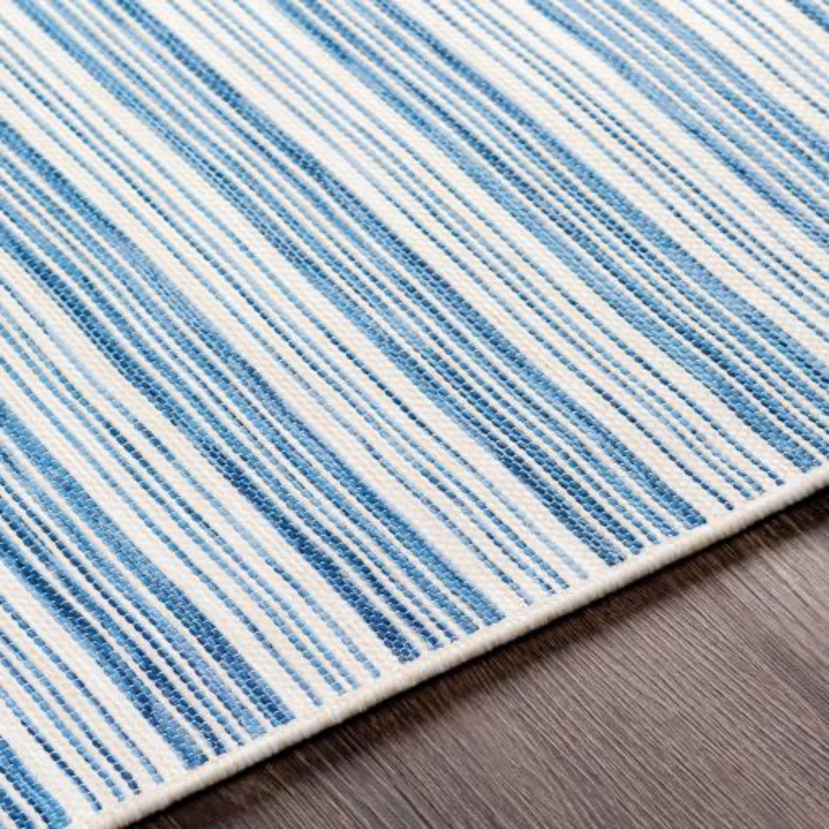 Portland Outdoor Rug - Blue edge detail. Close-up detail view.