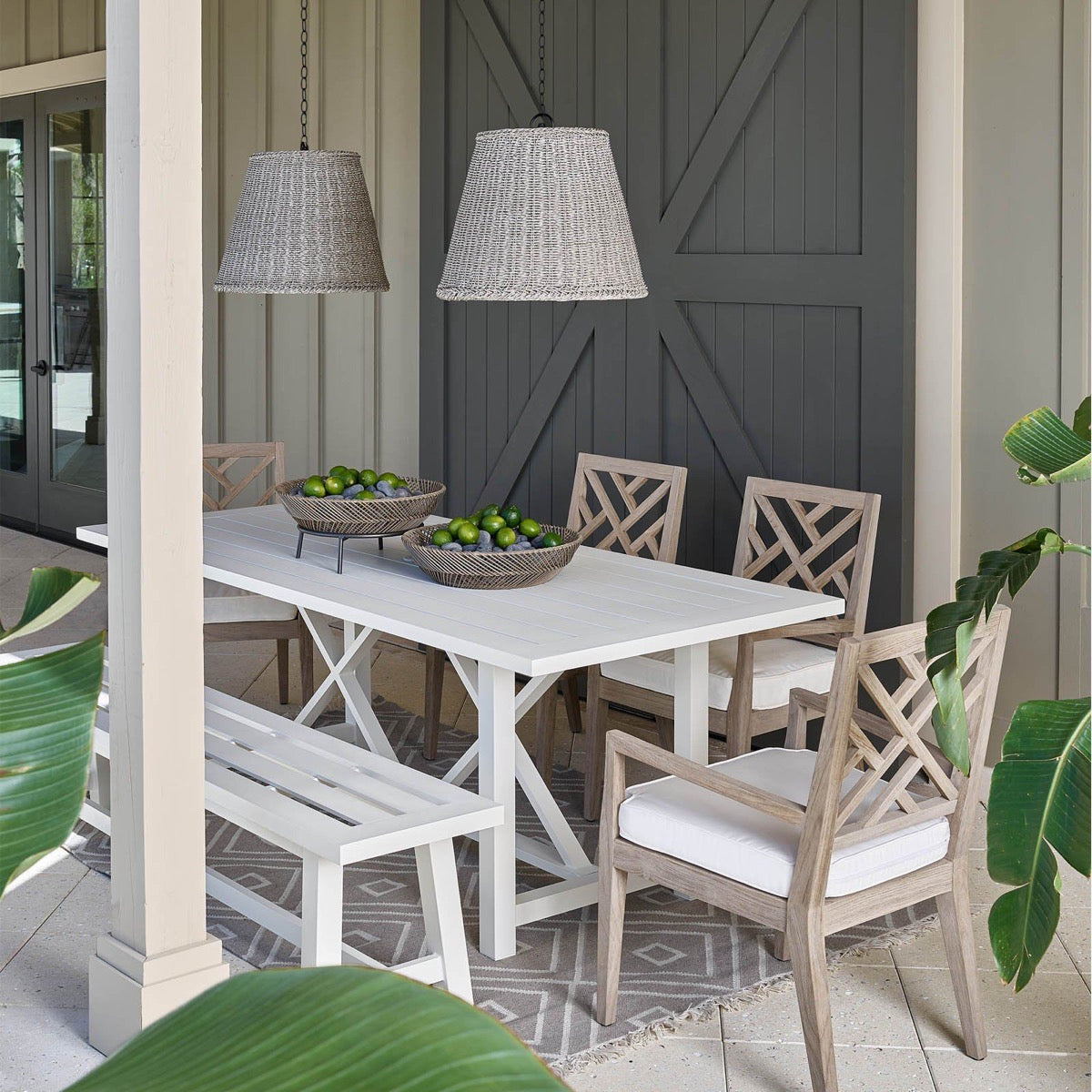 Augustine Outdoor Pendant - Large styled above a neutral table with lime baskets. Styled view.