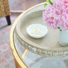 Round Marble Scalloped Bowl styled on a table with florals. Styled view.