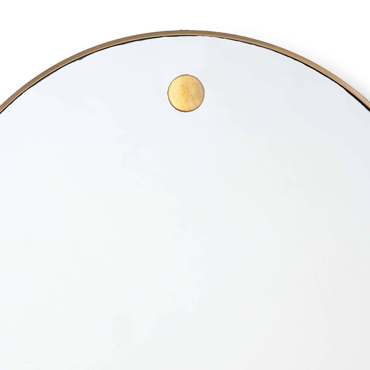 Ruby Circular Mirror top Natural Brass. Detail view.