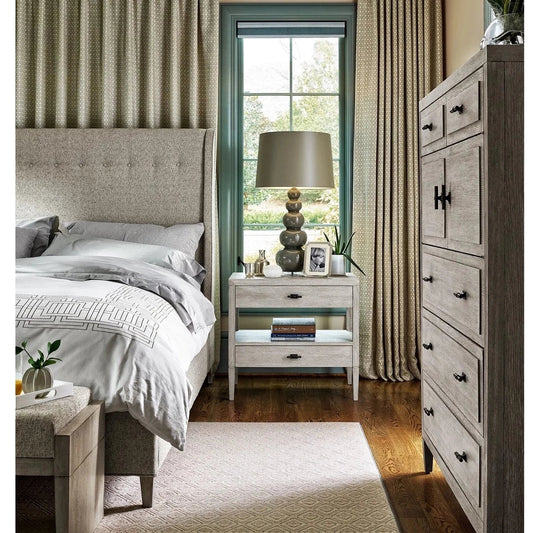 Sam End Table styled beside a grey bed with lamp, picture frames and decor. Styled view.