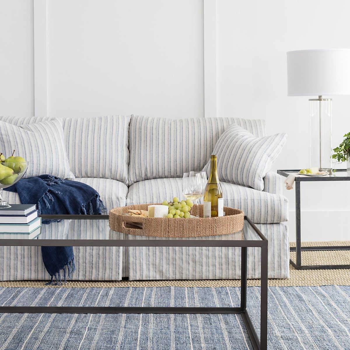 Samson Navy Indoor/Outdoor Rug styled in a grey living room. Styled view.