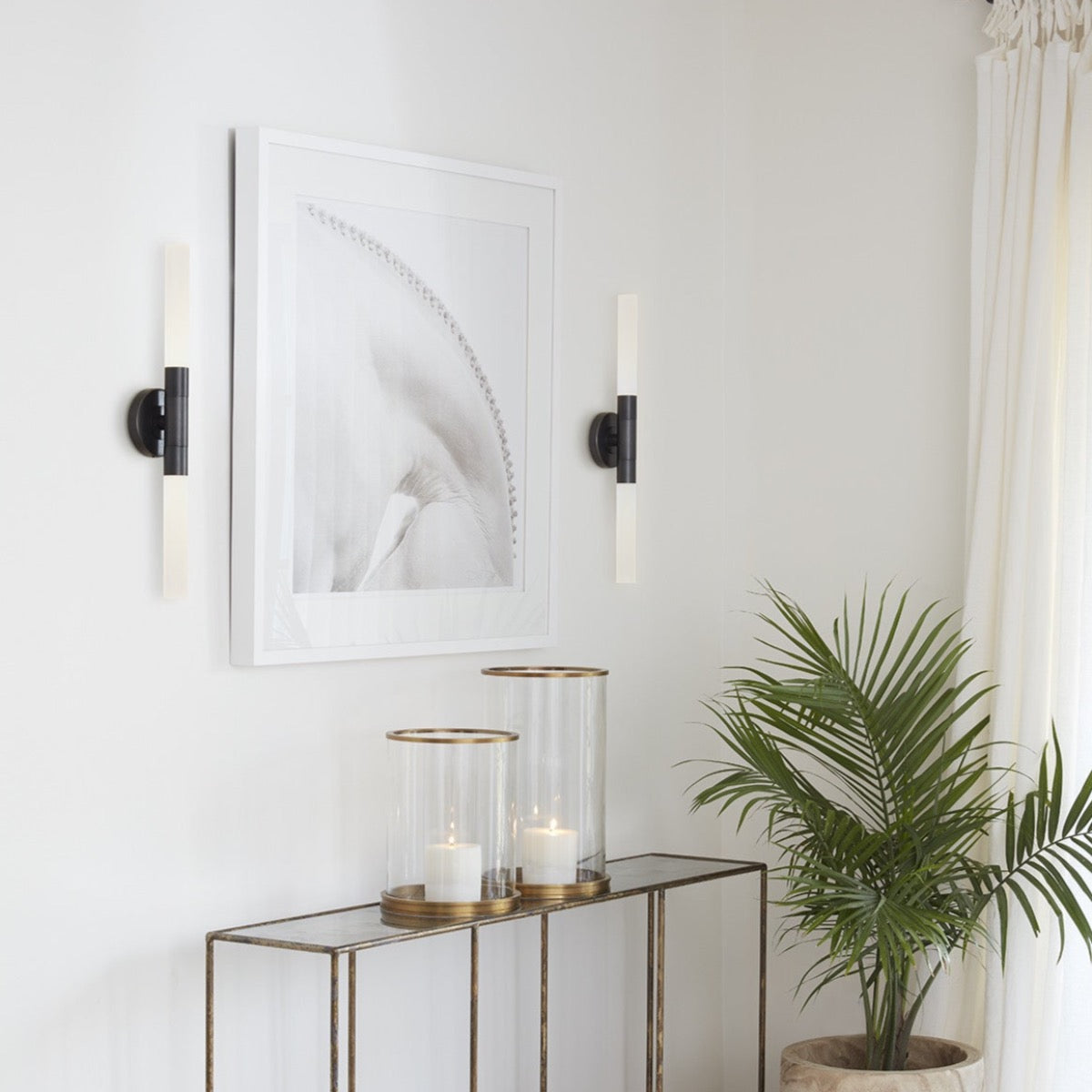Sarah Sconce styled on either side of artwork with gold details. Styled view.