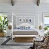 Sira Rattan Bench styled at the end of a bed with coastal furniture with blue accents. Styled view.
