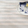 Swedish Stripe Woven Cotton Rug styled under a white tray with navy accents. Styled view.