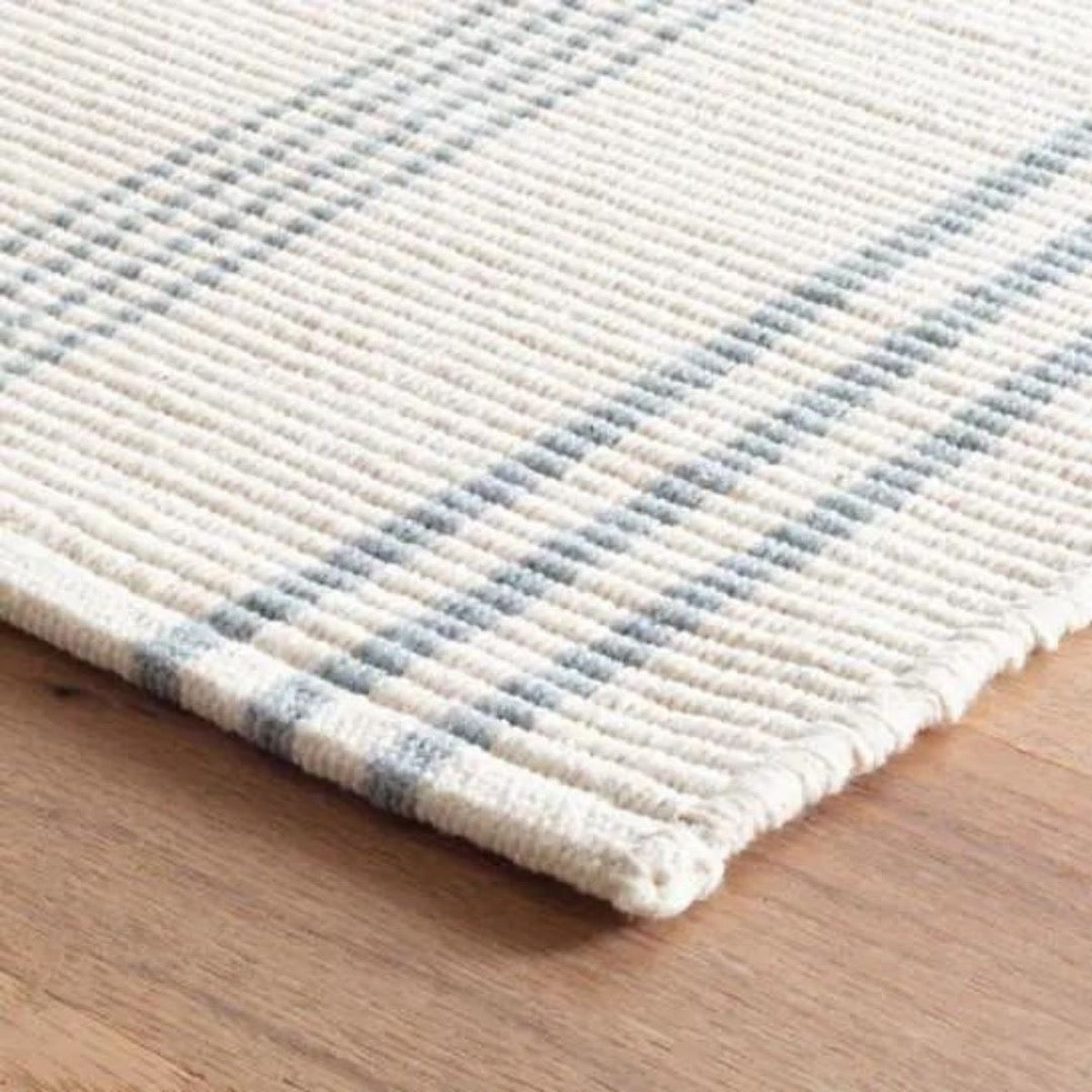 Swedish Stripe Woven Cotton Rug corner detail. Close-up detail view.