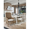 Taylor Arm Chair styled at the end of a white wood dining table. Styled view.