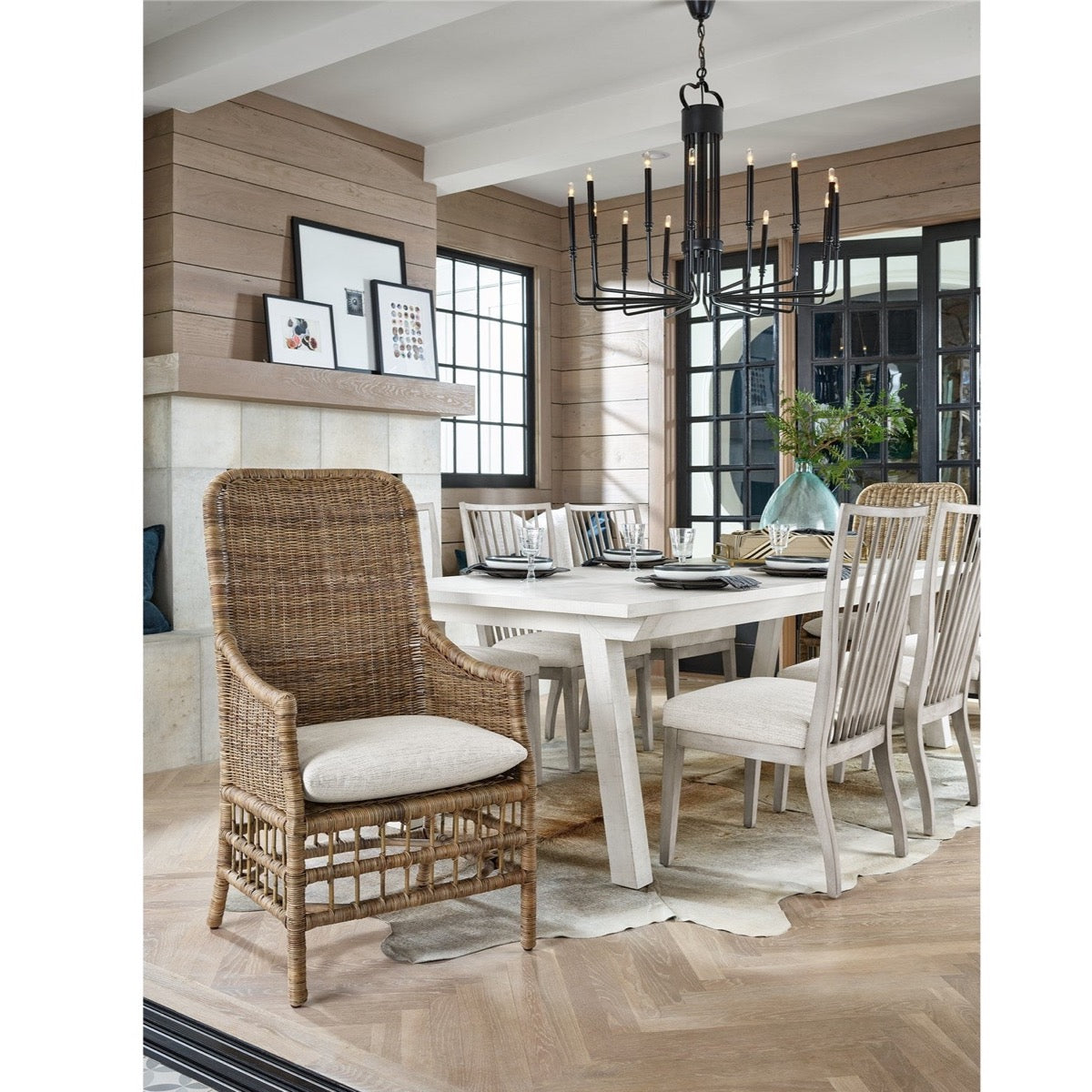Taylor Arm Chair styled at the end of a white wood dining table. Styled view.