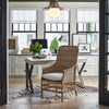 Taylor Arm Chair styled in an office space with desktop and greenery. Styled view.