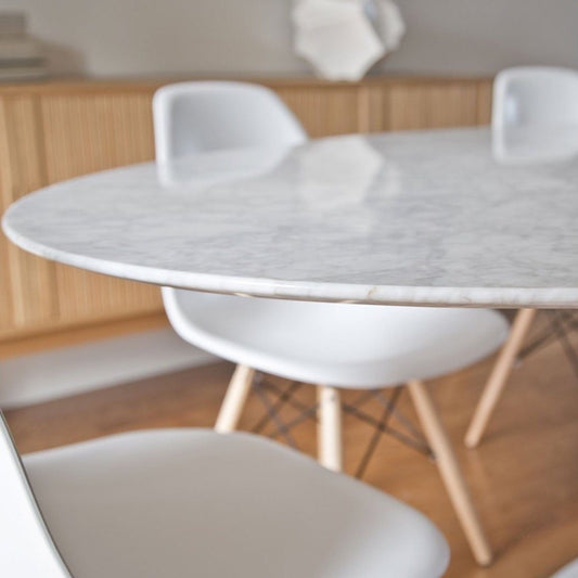 Trumpet Dining Table Oval with Marble Top - Small edge detail. Close-up detail view.