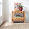 Twiggy Natural Woven Wool/Jute Rug styled in a room with wood table. Styled view.