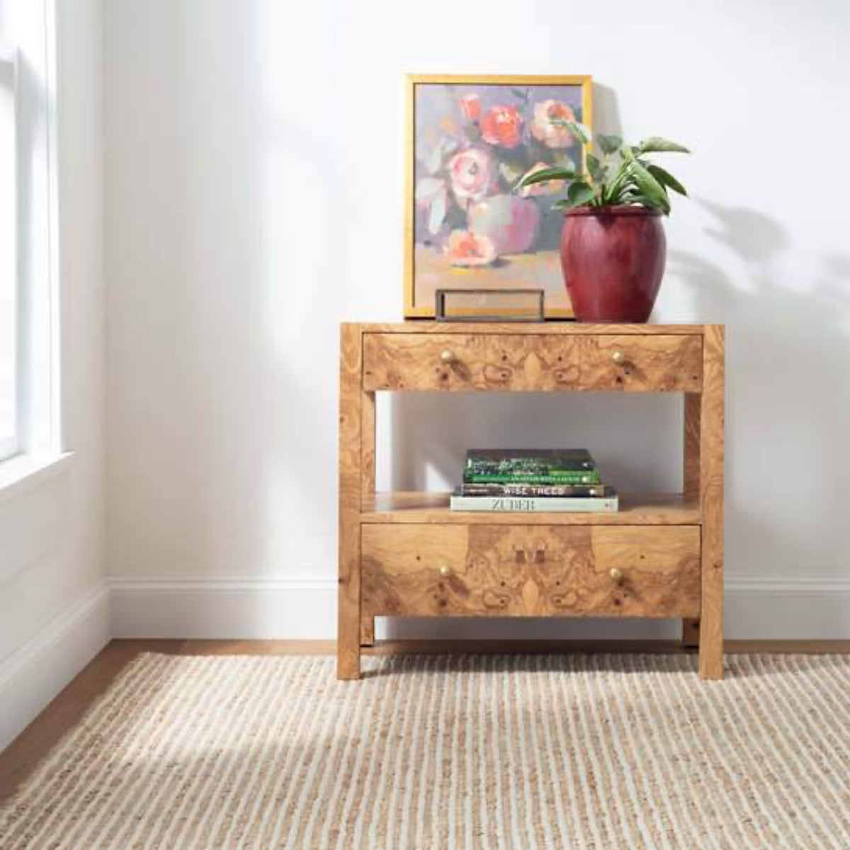 Twiggy Natural Woven Wool/Jute Rug styled in a room with wood table. Styled view.