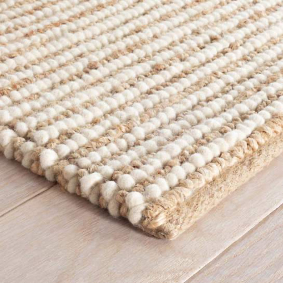 Twiggy Natural Woven Wool/Jute Rug corner detail. Close-up detail view.