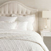 Washed Linen Ivory Quilt styled with white bedding. Styled view.