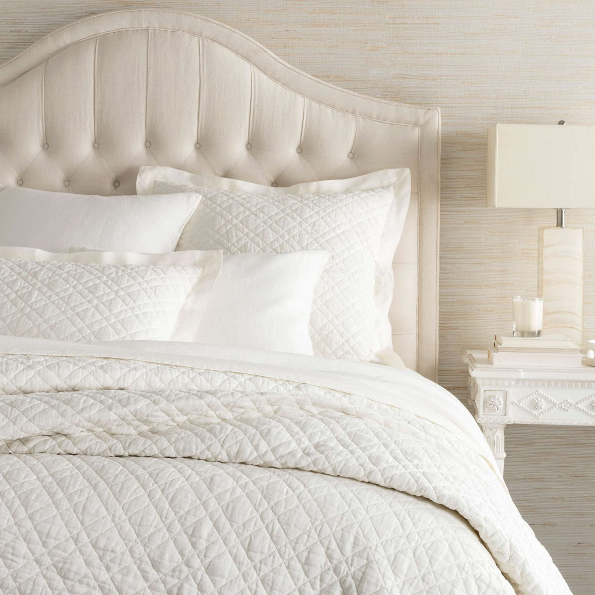 Washed Linen Ivory Quilt styled with white bedding. Styled view.