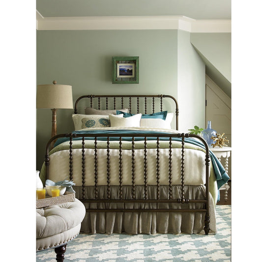 Weslie Bed Frame - Queen styled in a blue and green bedroom. Styled view.