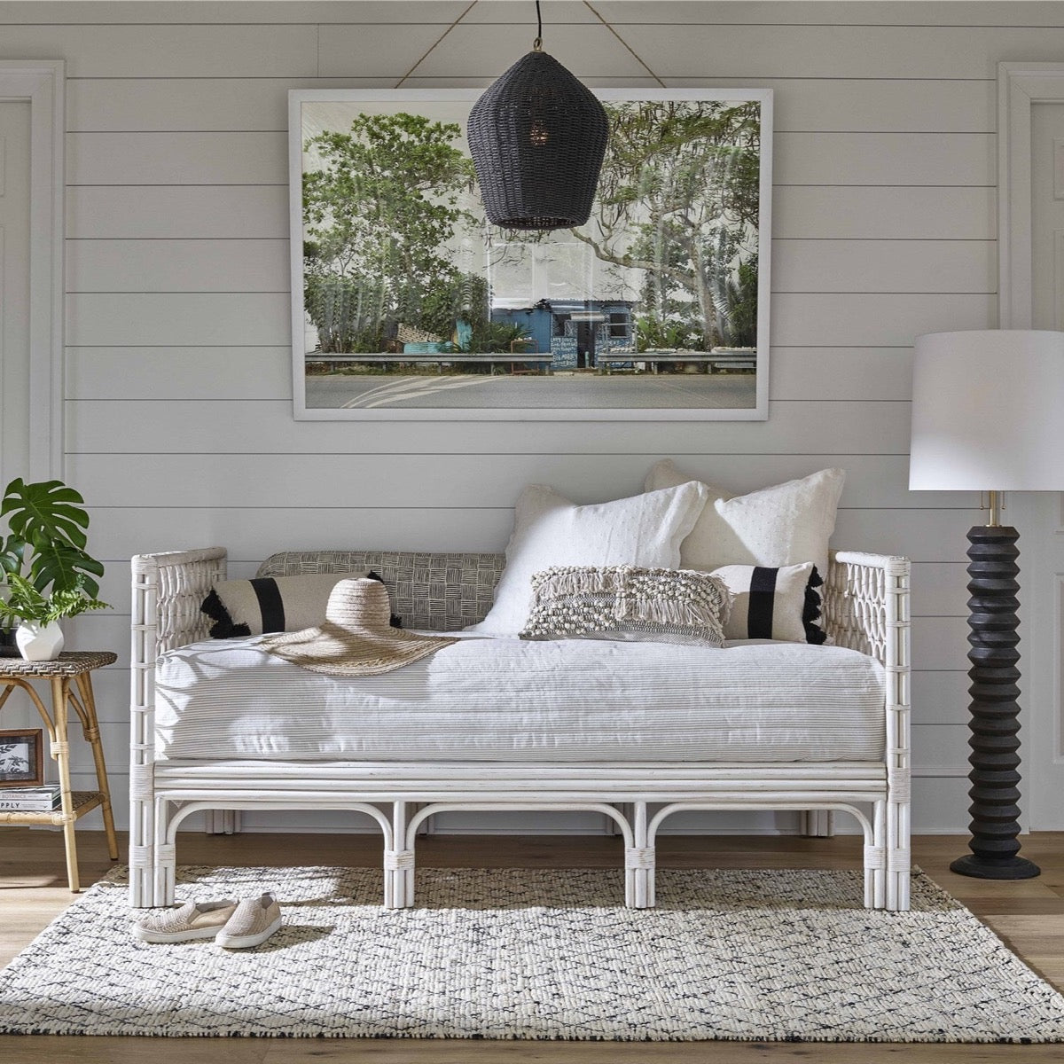 Westcoast Day Bed styled with neutral accents, floor lamp and chandelier. Styled view.