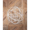 Whitman Pendant styled against a wood wall. Styled view.