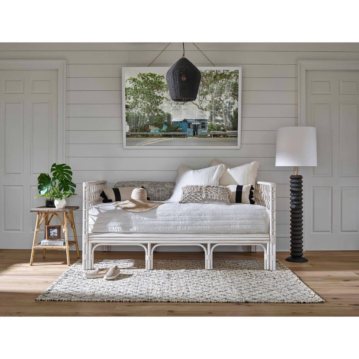 Georgian Pendant styled above a white day bed with neutral decor. Styled view.