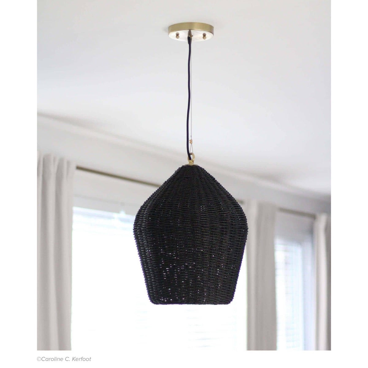 Georgian Pendant styled in a white room with large windows. Styled view.
