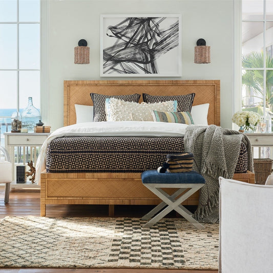 Willow Rattan Bed - King styled with black bedding, rattan sconces and just rug. Styled view.
