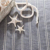 Archer Navy Woven Cotton Rug styled with nautical decor. Styled view. 