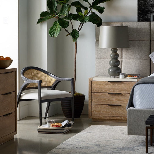 Bolten Accent Chair styled in a bedroom with blue bed and wood accents. Styled view.