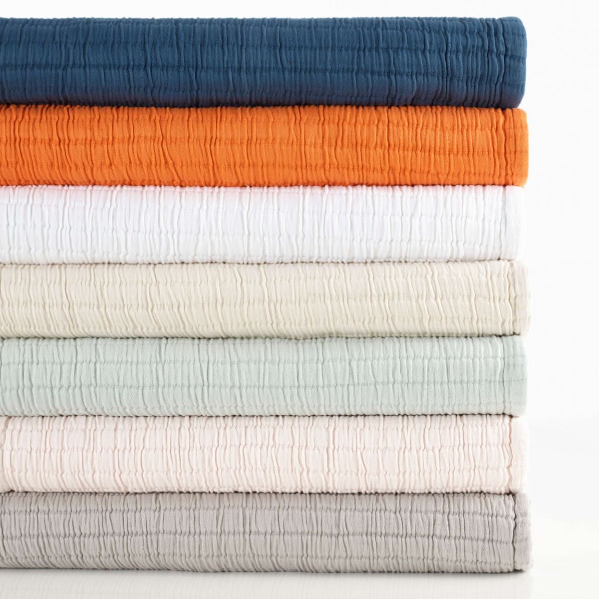 Boyfriend Grey Matelasse Coverlet stacked. Styled view. 