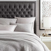 Boyfriend Grey Matelasse Coverlet styled with grey bedding. Styled view. 