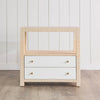 Casey Grasscloth Side Table styled in a white room. Front view.