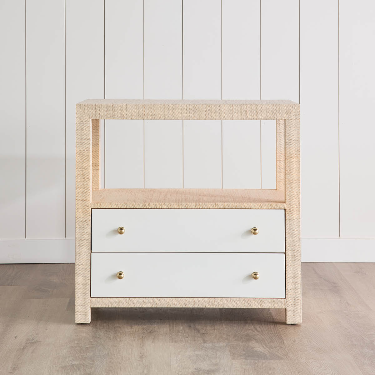 Casey Grasscloth Side Table styled in a white room. Front view.
