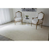 Dunes Jute Rug - Light styled in a neutral living room. Styled view. 