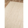 Dunes Jute Rug - Light over wood floor. Styled view. 