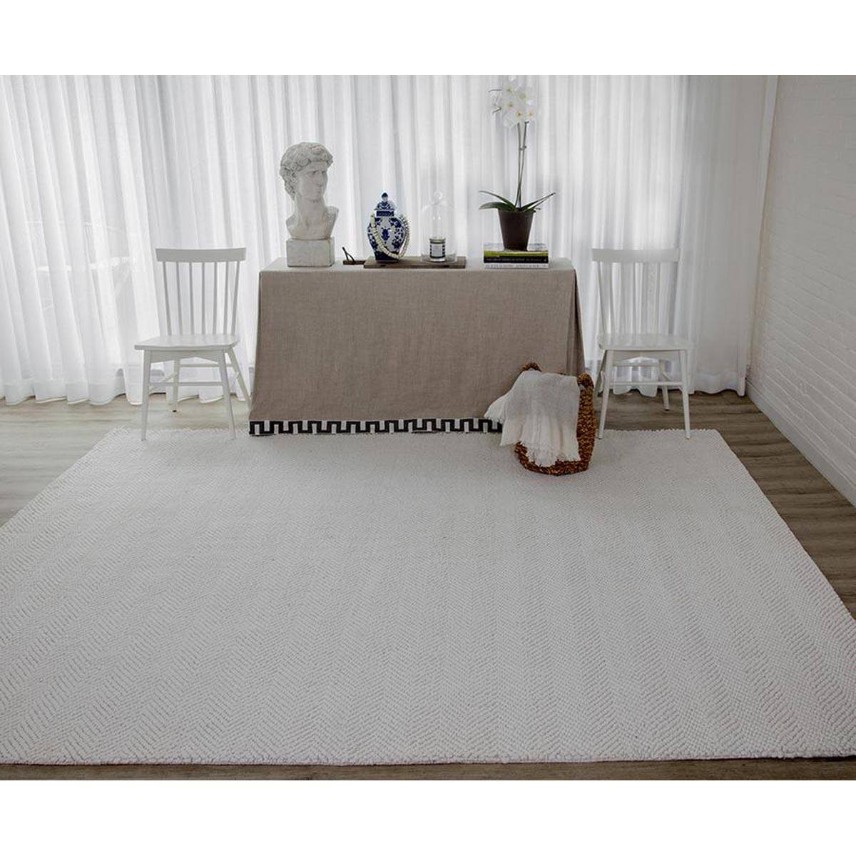 Edenbridge Rug - Ivory styled in a neutral living space. Styled view. 