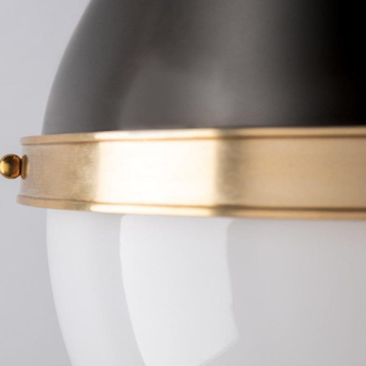 Edmond Wall Sconce brass rim detail. Close-up detail view.