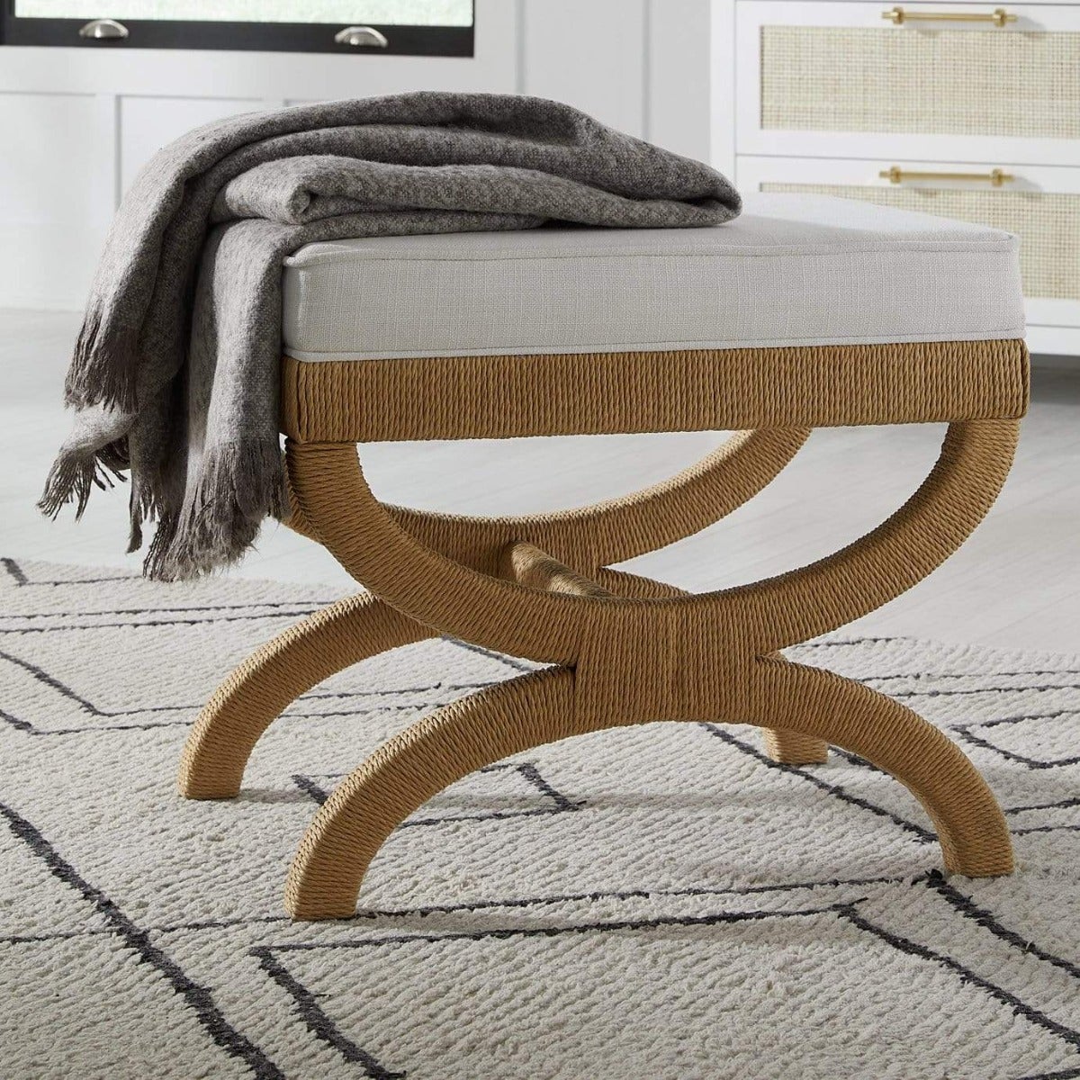 Emery Stool styled with a grey throw. Styled view. 