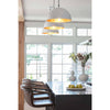 Flynn Pendant - Small White & Gold styled over a black kitchen island with large white windows. Styled view.