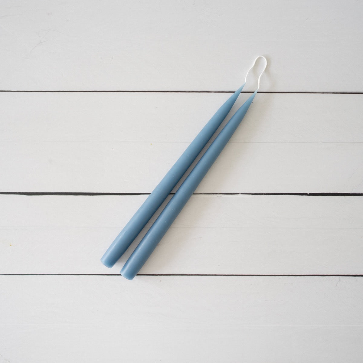 Hand-Dipped Danish Tapers - Blue/Grey on white back. Styled view.